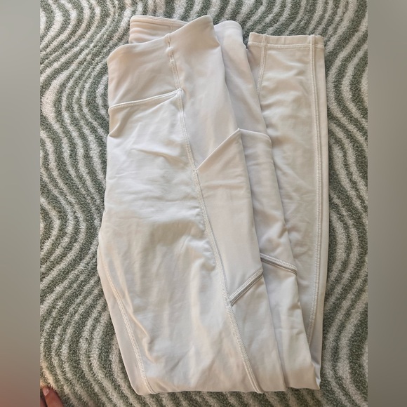 Never worn Lulu Lemon white leggings with side pockets. Size 6 - Picture 2 of 4